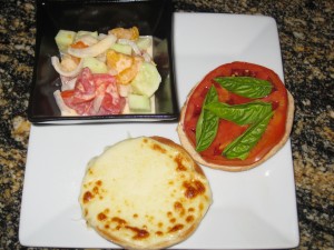 Mozzarella, tomato, & basil sandwich with cucumber, tomato salad